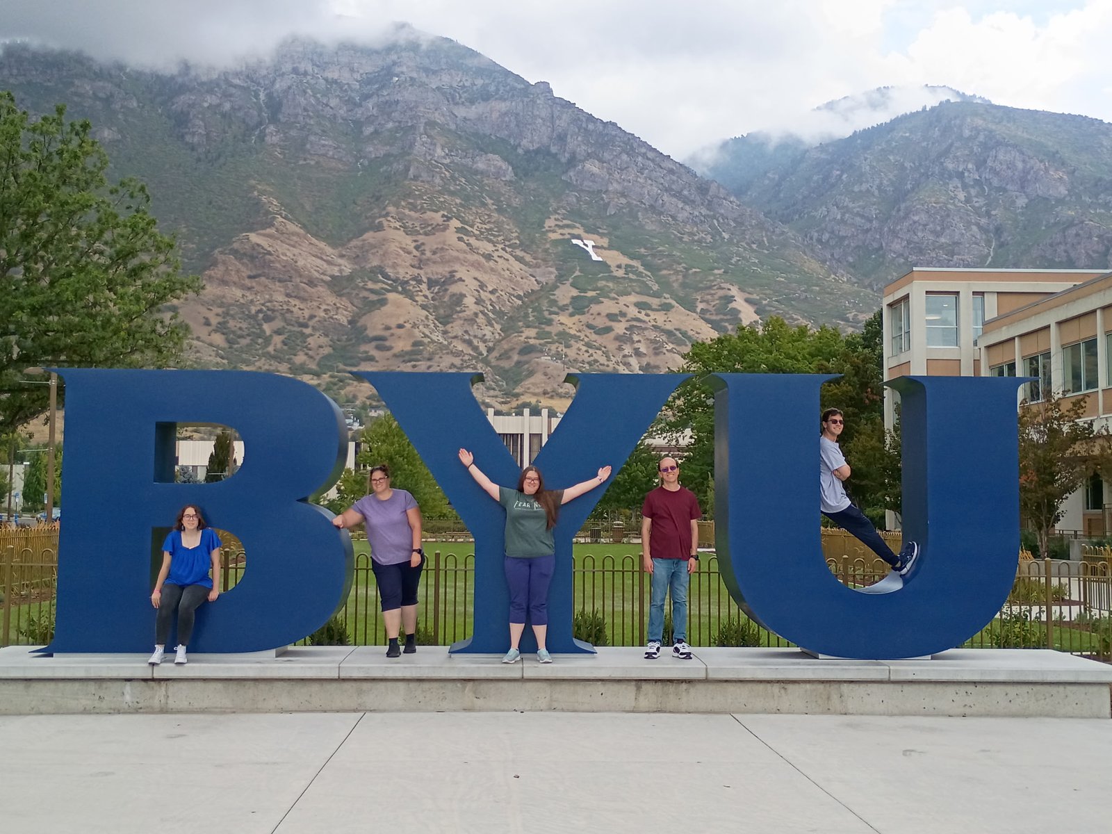 The family at the BYU sign