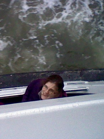 Mom peeking out of a boat window